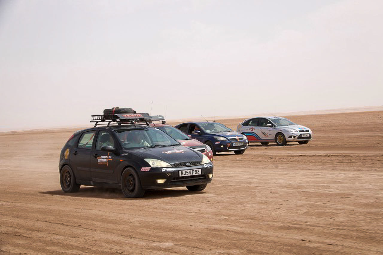 Four of the six Ford Focus hatchbacks taking on the Sahara